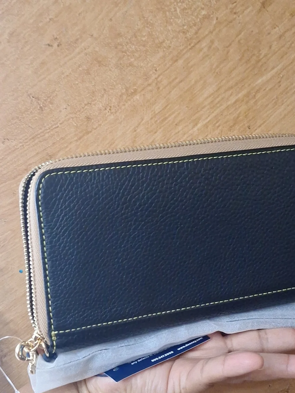 Dooney & Bourke Black Pebbled Zip Wallet with Tan Trim